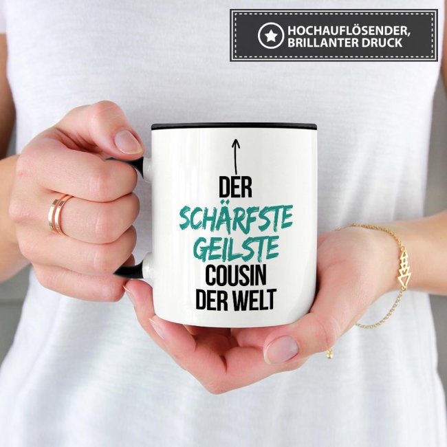 Tasse mit Spruch - Du bist der sch&auml;rfste, geilste Cousin der Welt - Innen &amp; Henkel Schwarz